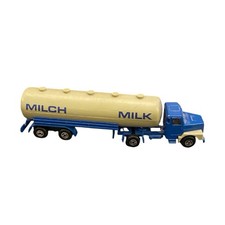 vintage model milk tanker truck, likely a die-cast toy.