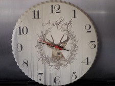 A WORKING GREY BOTTLE TOP WALL CLOCK WITH A STAGS HEAD AND “A WHITE WINTER"