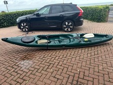 Used Kayak. Hurricane Kayak with paddles, 1 seat. British racing car green.