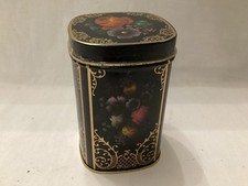 Small Black Tin depicting