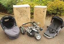 Quinny 3 wheeler  Black pushchair and baby carry cot also baby sleeping bag.