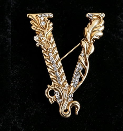 Gold tone letter crystal - v,