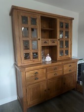 Solid oak dresser comes in 2 halves.  Many drawers and cupboards