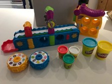 play-doh mega fun factory conveyor belt toy with tubs of playdoh