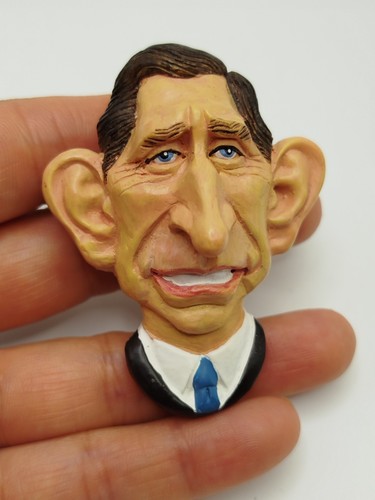 Spitting image pottery depicts - image,