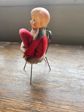 vintage pixie  sitting  on chair  1950s