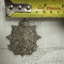 cap badge of The Border Regiment