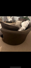 Brown DFS cuddle chair. Width