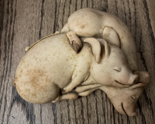 Sleeping pigs sculpture - sleeping,