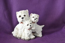 Three Westies, mum with two