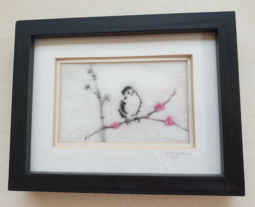 Hand felted framed bird on - hand,