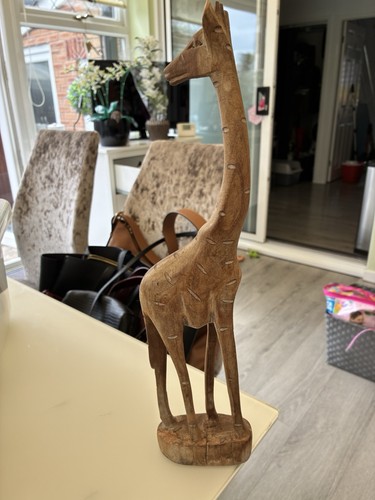 Hand carved wooden giraffe - hand,