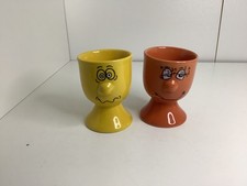 2 x Trade Winds Expressions Funny Face Multicoloured Egg Cups. Orange. Yellow.