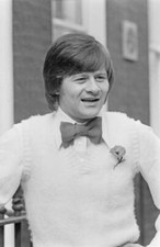 Alex Higgins shows off his new