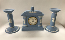 WEDGWOOD BLUE JASPERWARE DANCING HOURS CLOCK AND CANDLE STICKS GARNITURE