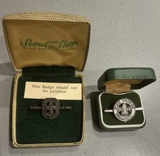 A PAIR OF VINTAGE  BOY SCOUT SILVER HALLMARKED BADGES IN ORIGINAL BOXES