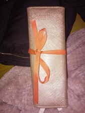 Caroline Gardner gold leather