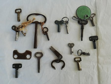 A collection of old pocket watch winder keys /toy keys.