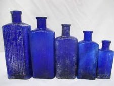 SUPERB SET OF 5 VINTAGE BLUE OBLONG RIBBED OLD POISON BOTTLES APOTHECARY CURE