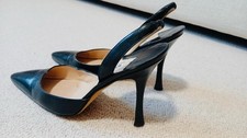 Manolo Blahnik black leather slingback heels.