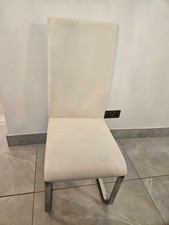 Cream faux leather cantilever dining chairs, 22 available
