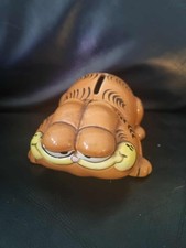Vintage Garfield money box lying down in good used condition with new stopper