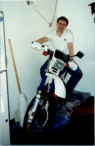 1990s man sitting honda - sitting,