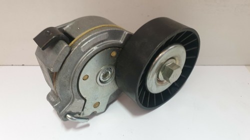 Alternator belt tensioner for