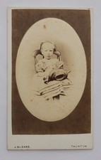 CDV OF A GIRL HOLDING A FLOWER