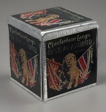 Dolls house old biscuit tin