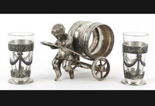A silver plated figural napkin