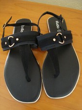 Ladies Black Toe Post D Ring Flat Sandal in sizes 3, 4, 5, 6, 7, or 8