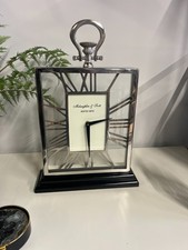 Contemporary Skeletal mantal clock chrome with a glass front