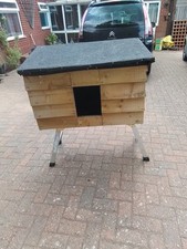 Small wooden homemade dog kennel outdoor