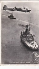 Avro Anson flying over HMS Revenge - old post card