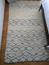 used good condition high pile wool rug cream with blue print 160 x 230 cms
