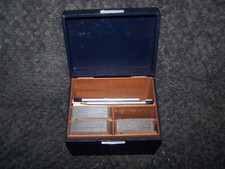 vintage wood playing card box with cards marking books pencils