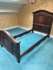 Antique French single bed with headboard and baseboard.