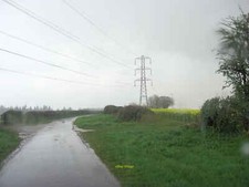 Photo 6x4 Pylons alongside