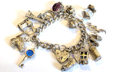 Hallmarked Vintage sterling silver charm bracelet 103.7 gms