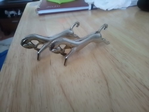Pair silver plated horse - a, of