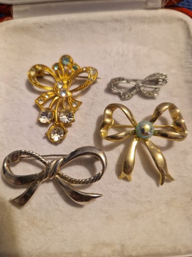 Joblot four bow brooches - joblot,
