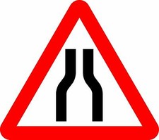  Road narrows on both sides