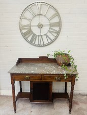 An attractive Edwardian washstand with cupboard & stretcher shelf.