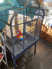 Large parrot cage . Metal bird cage with stand on wheels.