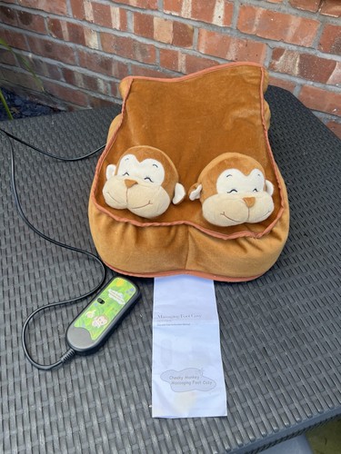Cheeky monkey massaging foot - monkey,