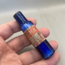 NICE SMALL 8 SIDED BLUE GLASS POISON BOTTLE VARIANT WITH ORIGINAL LABEL