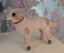 Antique Small Dog On Wheels