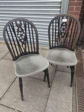 2 Oak wheel back chairs