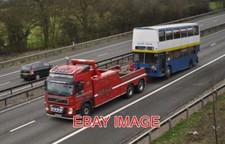 PHOTO  BROKEN DOWN BUS BEING